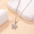 Macro view of a sparkling silver-toned flower pendant necklace with clear crystals - Five-Petal Flower Style (X-044) / Silver
