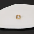 Close-up of French style 18k gold stainless steel stud earring with elegant shell inlay detail. - Four-leaf Flower Style / Gold