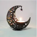 Elegant black hollow metal moon shaped candle holder with a hanging star pendant - Black