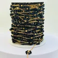 Detailed view of handmade black beaded chain with gold links for DIY jewelry making - Gold Black
