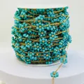 Detail of teal flower bead chain with gold accents for hand-woven DIY jewelry making. - Gold Turquoise Color