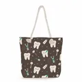 Detail of a brown canvas tote bag featuring a cute cartoon dental pattern and rope handle - Dark Brown Dental Tools All-over Print Style (ms4548)
