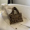 Fashionable women's leopard print plush handbag featuring a soft faux fur texture. - Leopard Print