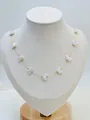 Elegant gold butterfly shell necklace displayed on a professional white jewelry bust - Gold Butterfly Style
