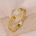 Elegant gold stainless steel heart bracelet watch featuring a sparkling rhinestone bezel - Script Hollow Heart Style (B01905)