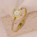 Detailed shot of a gold stainless steel bangle watch with sparkling crystal accents - Bar Rhinestone Decor Style (B01453)