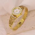 Detail of gold stainless steel bangle watch featuring hollow heart pattern and crystals - Hollow Heart Pattern Style (B01742)