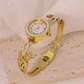 Detailed view of a gold-tone stainless steel rotatable bracelet watch with rhinestones - Hollow Leaf Style (B01747)