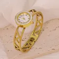 Elegant gold stainless steel bangle watch with rhinestone dial and hollow geometric band. - Geometric Hollow Pattern Style (B01384)