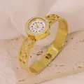 Elegant gold titanium steel bangle watch with sparkling rhinestone bezel detail - Roman Numeral Circle Hollow Style (B01392)