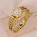 Elegant gold-toned stainless steel bangle watch featuring delicate hollow heart designs - Hollow Heart Pattern Style (B01397)