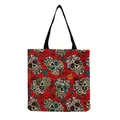 Detailed front view of a red canvas tote bag featuring colorful sugar skull prints. - Red Background Bright Day of the Dead Sugar Skull (hm6635)