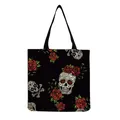 Close-up of a black tote bag featuring vibrant sugar skull and red rose floral prints - Black Background Colorful Sugar Skull and Red Roses (hm6637)