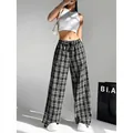 Pantaloni a gamba larga a quadri bianchi e neri da donna con vita alta stile trendy. - GK29 Quadri Neri e Bianchi