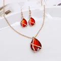 Elegant gold-plated set featuring large red teardrop gemstones and crossover design - Waterdrop Jewelry Set / Red