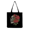 Detailed view of the skull and red roses graphic print on a black canvas tote bag - Side Realistic Skull and Three Red Roses (hm6641)