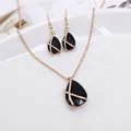 Elegant gold-tone jewelry set with large black teardrop stones necklace and earrings - Waterdrop Jewelry Set / Black