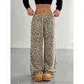 Detailed view of fashionable leopard print wide-leg trousers with drawstring waist - S / GK25 Light Leopard
