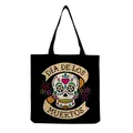 Detail view of a black canvas tote bag with a colorful sugar skull and Dia de los Muertos print - Day of the Dead Colorful Sugar Skull Print (hm6648)