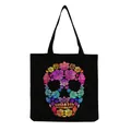 Detailed macro view of the colorful floral skull print on this black canvas tote bag - Colorful Floral Patchwork Skull Pattern (hm6654)