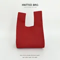 Minimalist red knitted wrist bag with a textured finish for gift packaging - Red