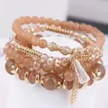 Pulsera bohemia elástica multicapa con cuentas de ámbar y elegante colgante de cristal - Café