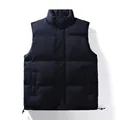Men's navy blue quilted puffer vest with stand collar and adjustable drawstring hem. - M / Dark Blue