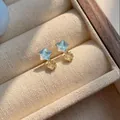 Dainty blue and yellow star stud earrings with an iridescent finish in a jewelry box - Light Blue Five-Pointed Star (925 Sterling Silver Earring Post)