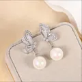 Elegant silver-tone butterfly pearl drop earrings with sparkling pave crystals details - Butterfly Rhinestone Pearl (925 Sterling Silver Earring Post)
