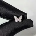 Detailed SKU image of a silver butterfly earring with pavé diamonds and pink gem. - Silver Pink Stone Butterfly (925 Sterling Silver Earring Post)