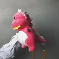 Cute pink plush dinosaur shoulder bag with soft fuzzy texture and adjustable yellow strap - Pink