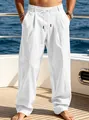Detailed view of men's loose white linen-style beach pants with comfortable drawstring waist - S / White