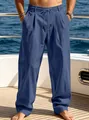 Detail of men's blue loose straight-leg casual beach pants with drawstring on a yacht - S / Navy Blue