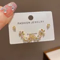 Detail view of Korean style gold butterfly and flower crystal stud earrings set. - 6# Gold - Fully Diamond-enhanced Flower And Butterfly Three-piece Set (thickened Real Gold Plating)