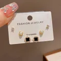 Detail of three-pair stud earring set featuring black clover, pearls and crystal studs - 10# Gold-plated Four-leaf Clover Pearl Earring Set (thickened Real Gold Plating)