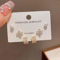 Detailed view of a 3-pair earring set featuring pearls and crystal-encrusted designs - 13# Gold-pearl Zircon Curved Three-piece Set