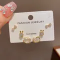 Detailed view of 3-pair earring set featuring bow, rabbit, and crystal cat head studs. - 14# Gold - Fully Rhinestone Kt Cat Bow Three-piece Set (thickened Real Gold Plating)