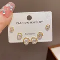 Detailed view of three pairs of elegant gold round stud earrings with sparkling stones - 15# Gold-plated Zircon Circle Stud Earrings (thickened Real Gold Plating)