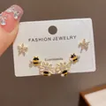 Close-up of 3-pair earring set featuring crystal flowers and enamel bees - 17# Bee And Daisy Three-piece Set (thickened Real Gold Plating)