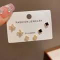 Elegant three-pair stud earring set featuring black and crystal floral clover designs in gold - 47# Four-leaf Clover Personalized Earring Set (thickened Real Gold Plating)