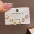 Elegant set of 3 pairs of geometric stud earrings with white stone inlay in gold finish. - 53# Cat's Eye Geometric Earrings Three-piece Set (thickened Real Gold Plating)