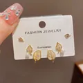 Elegant Korean style gold-plated leaf stud earring set featuring pearls and crystals - 64# Gold-set Three-piece Earring Set With Diamonds Pearls And Leaves (thickened Genuine Gold Plating)