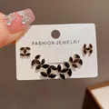 Elegant black marquise gemstone 3-piece earring set presented on a fashion jewelry card - 70# Gold-black Fully Rhinestone Chanel-style Cross-pattern Three-piece Set (thickened Real Gold Plating)