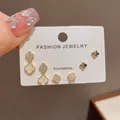 Exquisite Korean style minimalist clover earring set featuring gold and white floral motifs - 82# Gold-tone Zircon Four-leaf Clover Three-piece Earring Set (thickened Real Gold Plating)