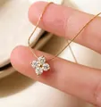 Elegant gold necklace with a delicate four-stone flower-shaped pendant - Four-leaf Flower Zirconia / Gold