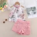 Detailed flat lay of children summer floral halter top and pink shorts outfit. - 90cm / Pink