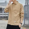 Durable men's khaki workwear shirt jacket featuring graphic sleeve prints and utility pockets - Khaki
