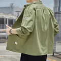 Durable army green workwear shirt jacket for men with stylish white sleeve print - M / Green