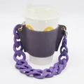 Detail of purple leather cup sleeve with chunky plastic chain handle on a white cup - Purple