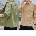 Durable men's casual work shirt jacket available in army green and khaki colors. - Green + Khaki